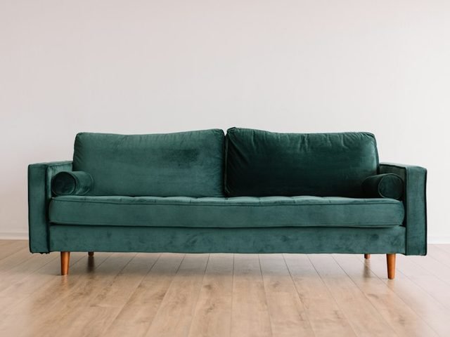 Living room with a green sofa